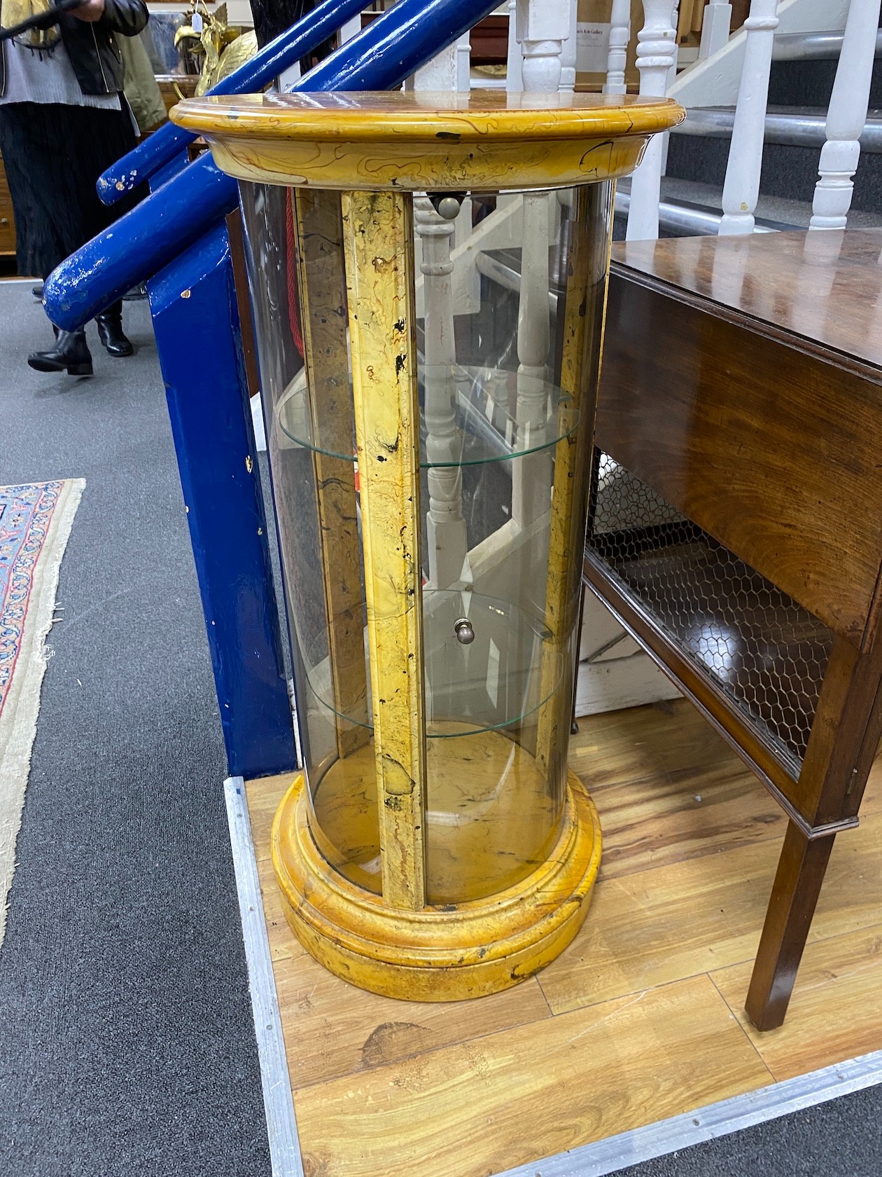 A pair of faux marble glazed cylindrical display cabinets, height 88cm, diameter 42cm